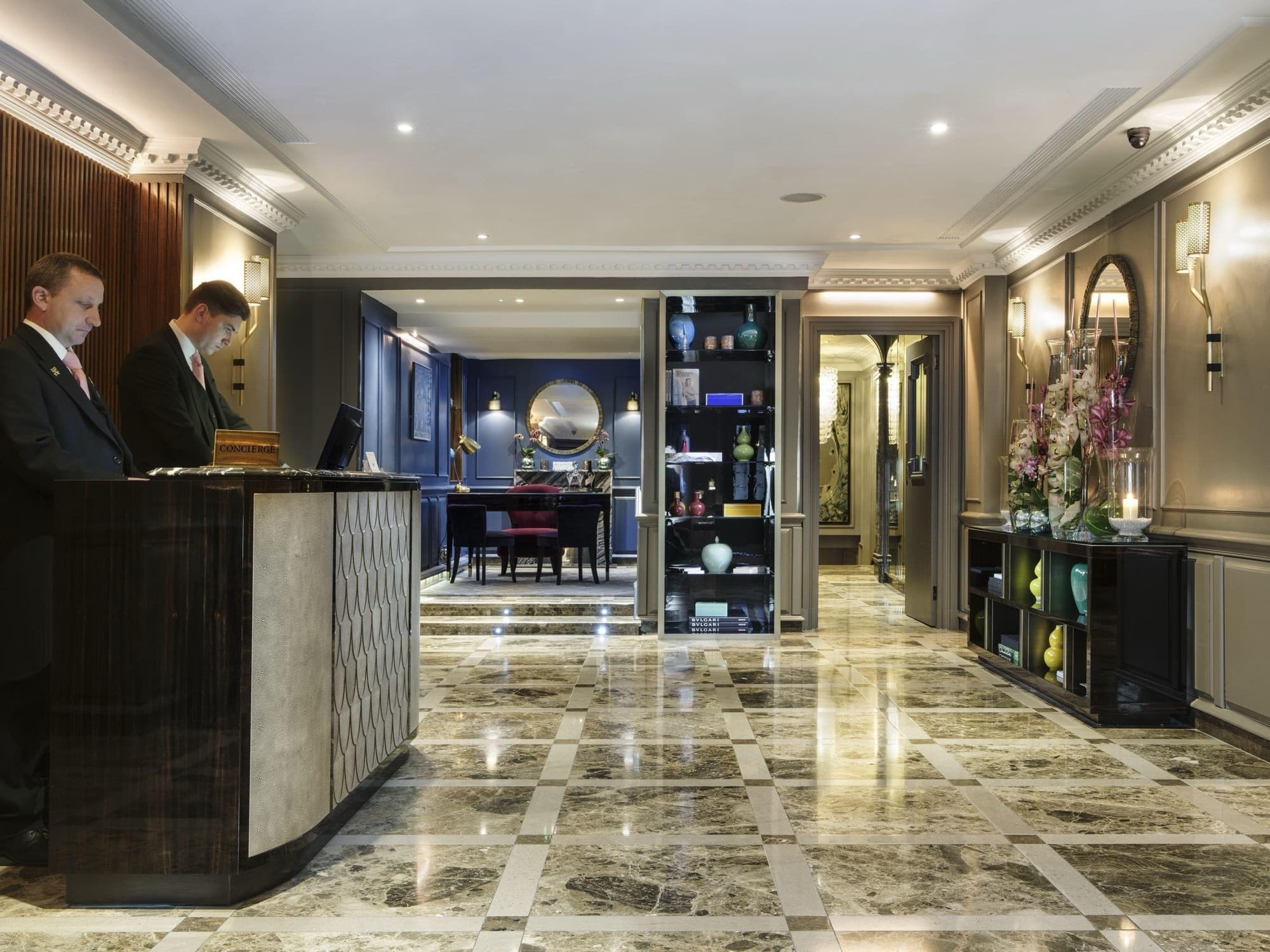 Reception of a completed London hotel with layered architectural lighting