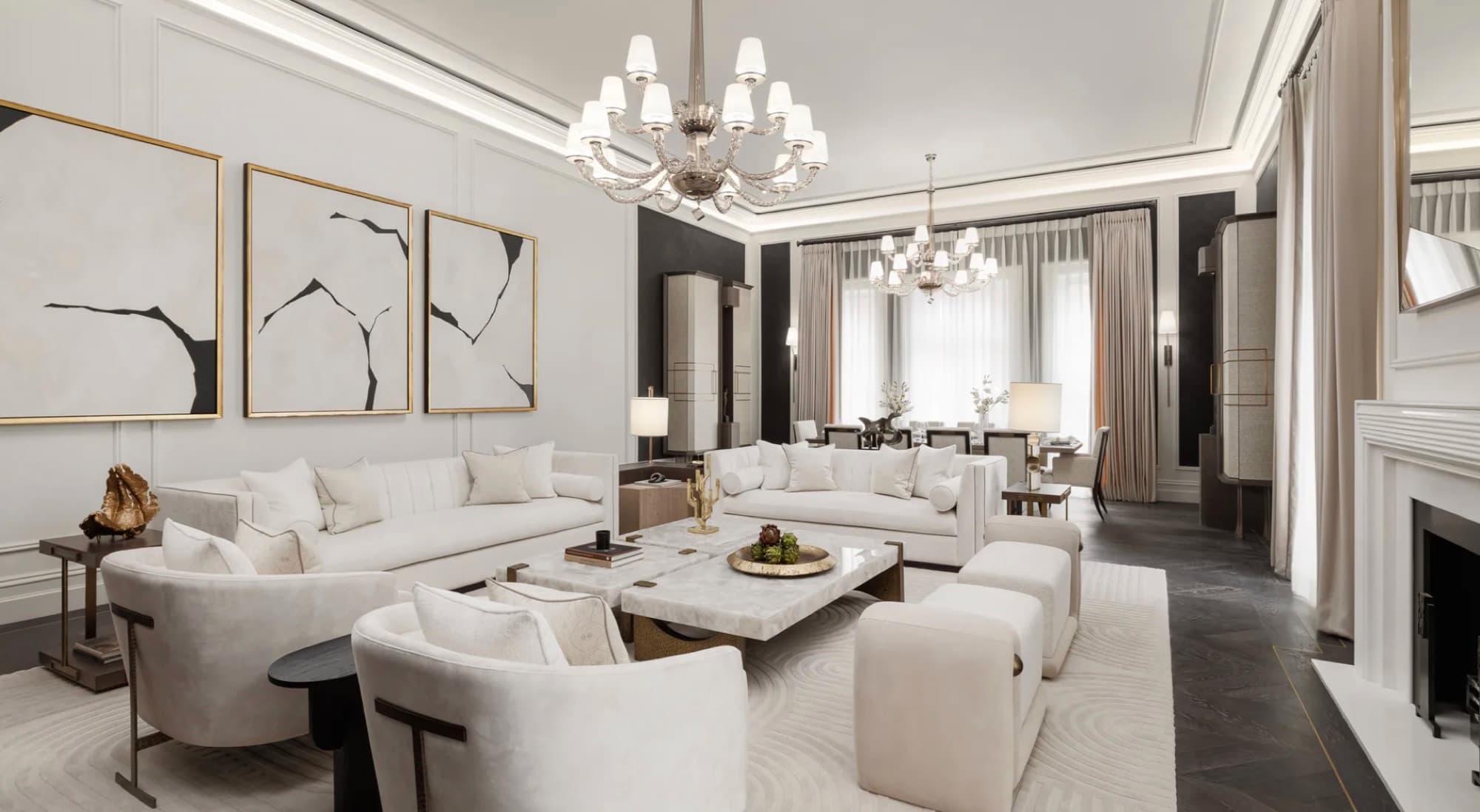 Neutral principal bedroom with upholstered headboard wall and recessed ceiling detail