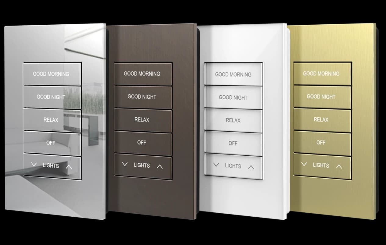 Four Crestron keypads in different finishes: polished chrome, brushed bronze, gloss white and brushed brass: each engraved Good Morning, Good Night, Relax, Off and Lights